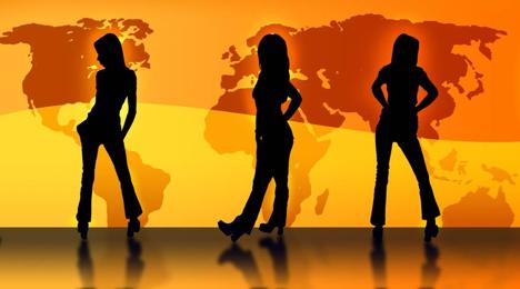 Silhouettes of girls in front of a world map