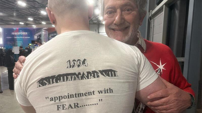 Oliver Duhl (Series 8, Team 7 Dungeoneer) with Hugo Myatt at FanX Live in October 2024. The back of Oliver's shirt reads '1994 Knightmare VIII. 