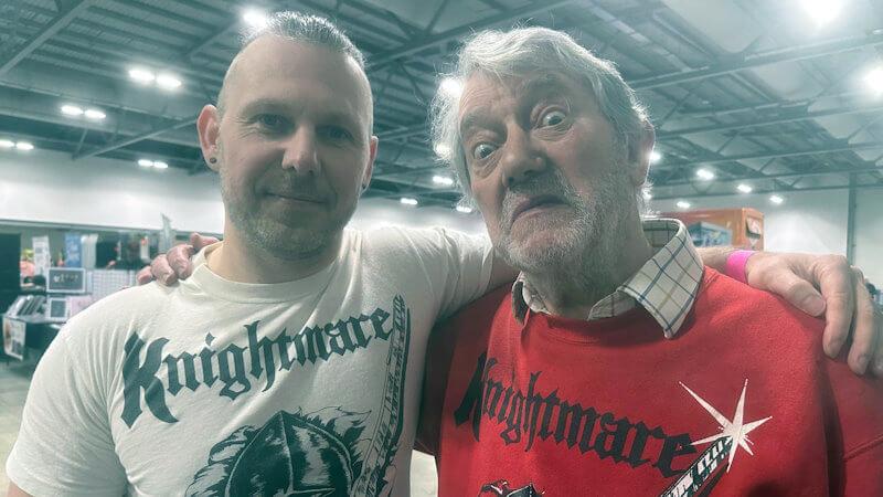 Oliver Duhl (Series 8, Team 7 Dungeoneer) poses with Hugo Myatt doing an impressionable Treguard glare at FanX Live in October 2024