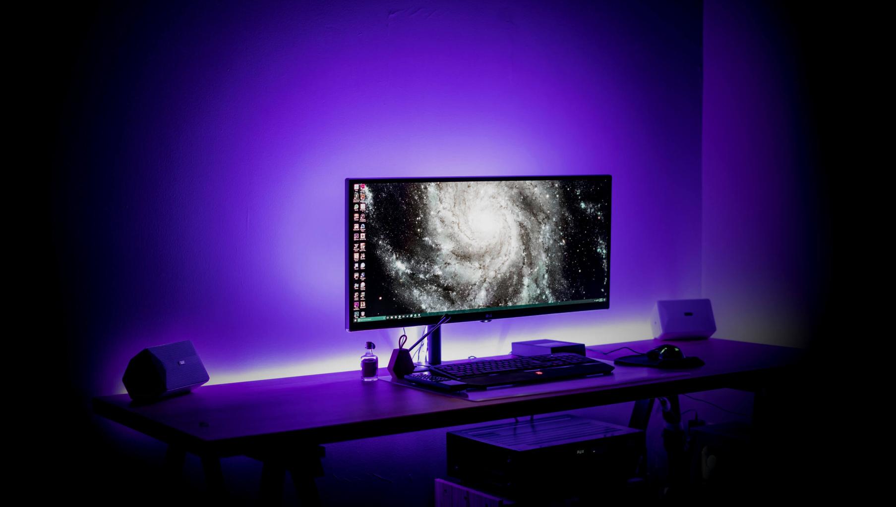 Gaming computer in ambient light. Photo by bantersnaps on Unsplash.