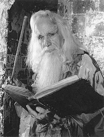 A 1988 character shot of Merlin with book (John Woodnutt).