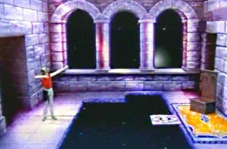 Knightmare Series 3 Team 12. Chris pretends to fire a bow to evoke a step in Merlin's chamber.