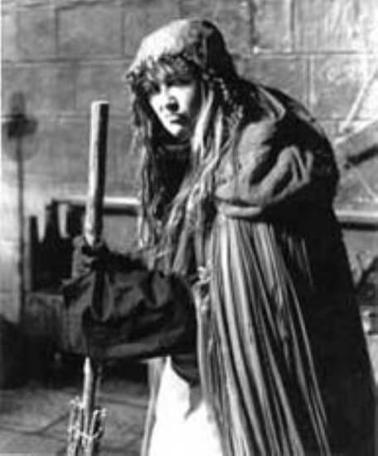 A 1990 character shot of Mistress Goody (Erin Geraghty).