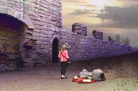 Knightmare Series 5 Team 3. Sarah finds clues by a castle wall.