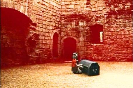 Knightmare Series 5 Team 8. Duncan unlocks a chest in a courtyard.